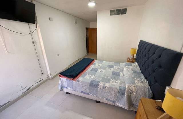 A bedroom and a bathroom