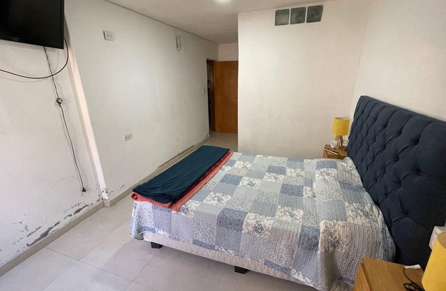 A great room with a comfortable bathroom with hot tub