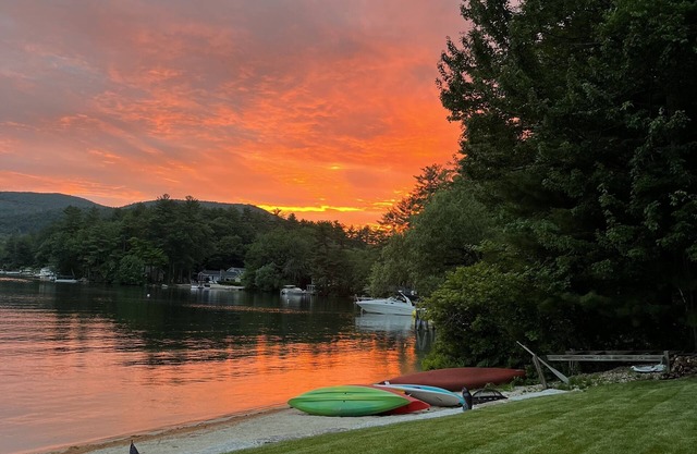 A quiet cove, the sunset and a sandy beach, on Lake Winnipesaukee