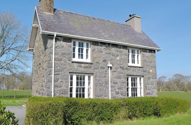 A spacious detached property with an open fire and enclosed garden.