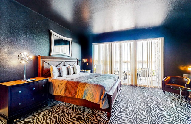 An unforgettable stay awaits at this sultry Delton Grand studio with dance pole