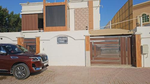 Anushthan Villa a private serviced villa for events and staycation with luxury views of garden and fountain pool in UAE