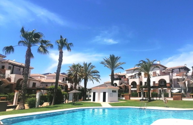 Apartment in gated community with Wifi and views of the pool and gardens