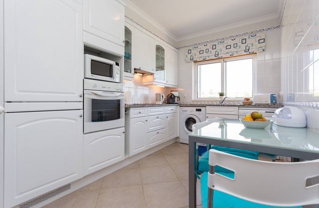 Apartment with heated communal pool, golf view, sky sport channels, and spa acce