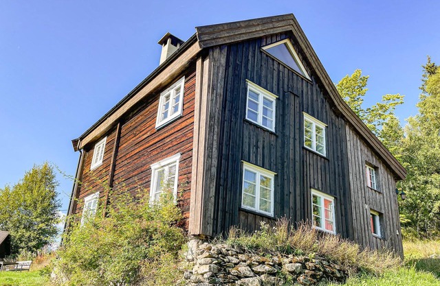 Atmospheric cottage with charming view of mountains and lake.