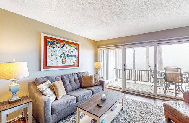 Bayfront condo with lake & bay views, deck, 2 fireplaces, private washer/dryer