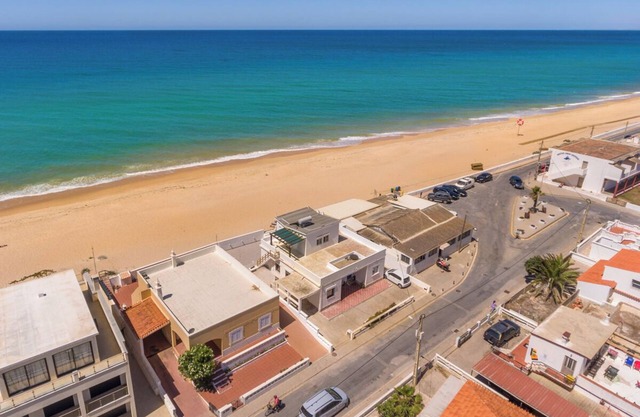 Beach front right on the Sand Luxury semi-detached 3-bed house on the beach.