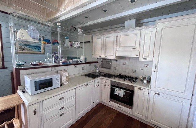 Beach house including beach umbrella and swimming pool with Jacuzzi