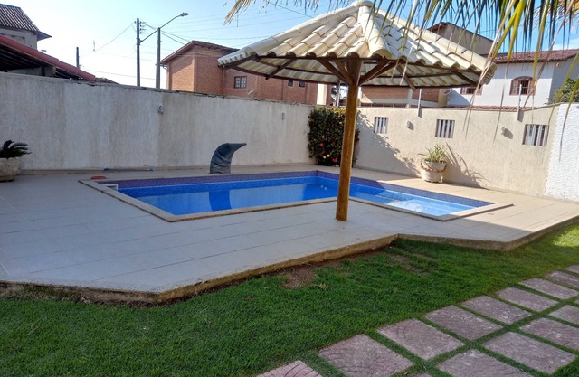 Beach house with swimming pool, sea view, backyard and barbecue area