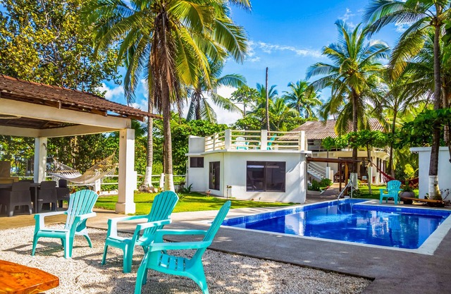 Beachfront dog-friendly home with private pool, grill, hammocks, & beach access