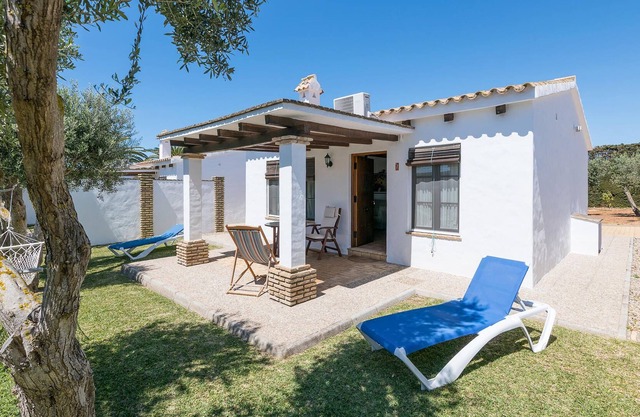 Beautiful complex of three houses with garden and community pool.