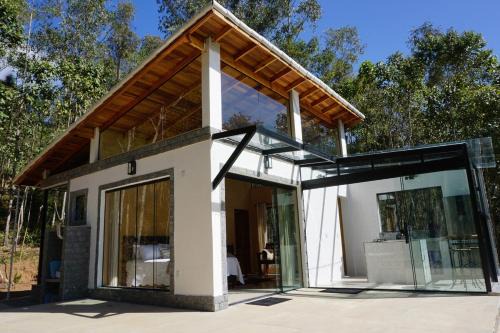 Beautiful glass house with a view and lush water