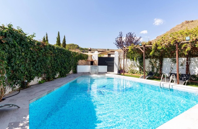 Beautiful house with pool, patio and barbecue.