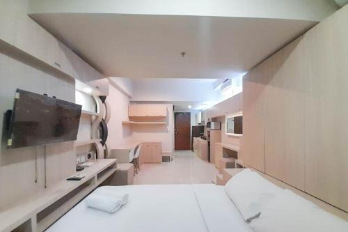 Best Homey and Modern Studio at Uttara The Icon Apartment By Travelio