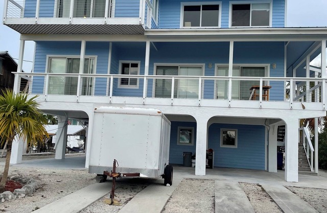 Big Pine House, 4/2 two story, canal access 75 ft dock and stunning Bay view.