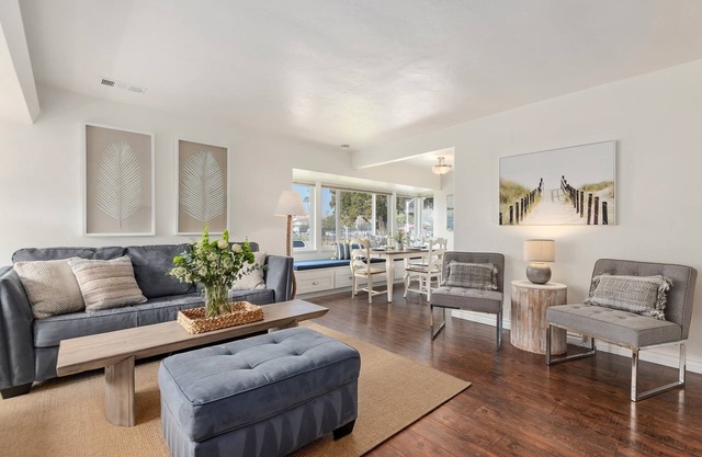 Bright and Airy Coastal Condo Just a Half Block Away From East Beach!