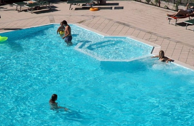 Bright and modern apartments with pool and beach and luxurious villas on the S