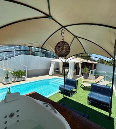 Casa com piscina área gourmet Enseada Azul
