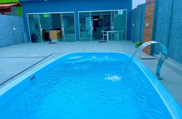 Casa com piscina e hidromassagem praia Enseada.