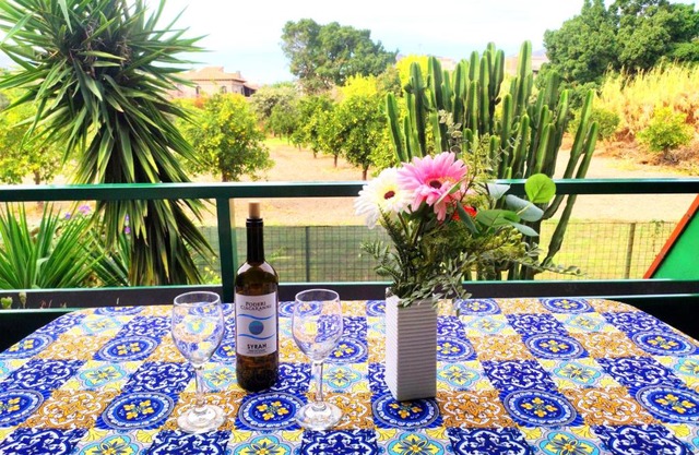 Casa dei Fiori con la vista a Taormina