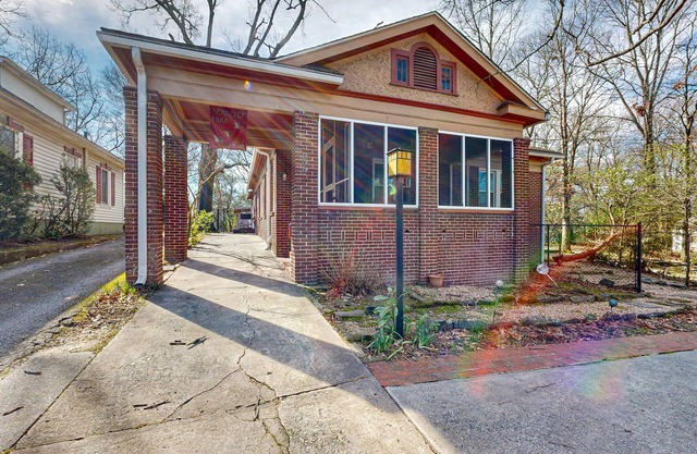 Centrally located retreat with a separate cottage, large yard, W/D, & central AC