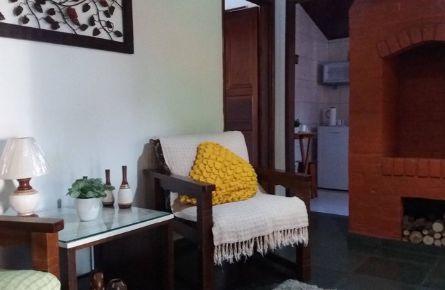 Chalé das Carpas in Penedo in front of the waterfall with full kitchen.