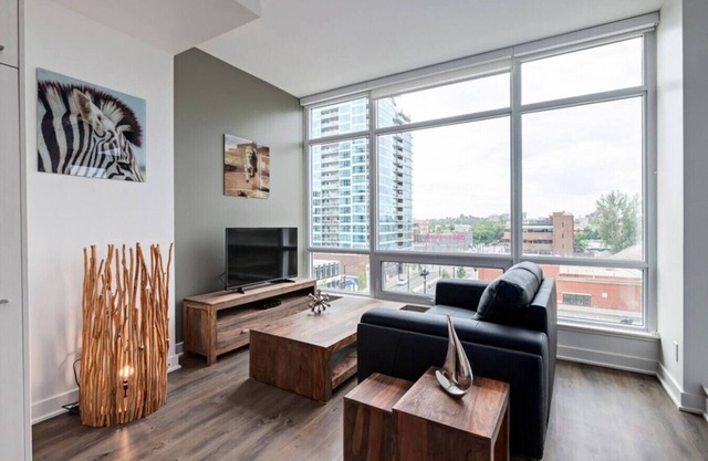Chic 1BR Apt with Balcony and City Skyline Views