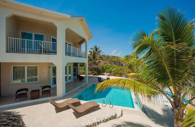 Christmas Palms: Serene Villa with an Oceanfront Pool and Private Beach