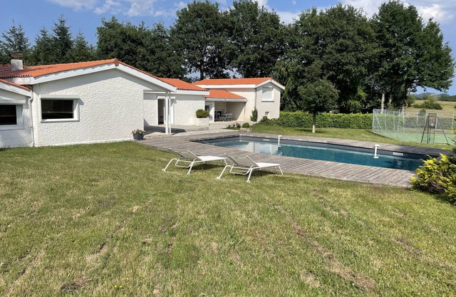 Contemporary house with swimming pool and tennis court