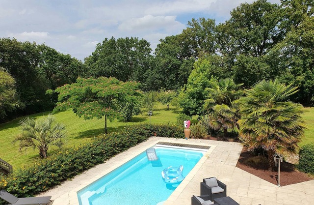 Cosy house with swimming pool in landscaped grounds