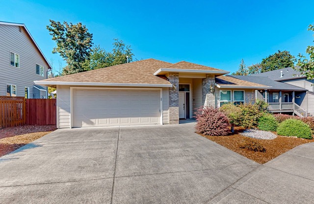 Custom-built home alongside greenspace with deck & massage chairs