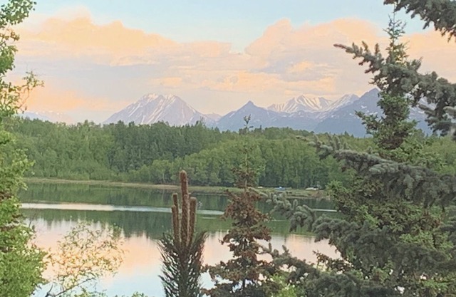 Custom built modern cabin with a loft on a lake with mountain views.