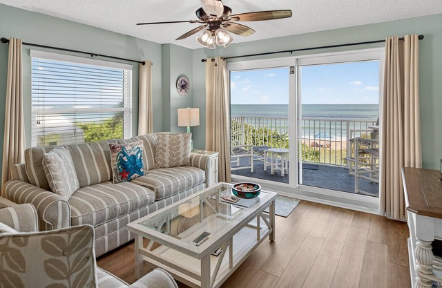 Direct oceanfront corner condo with large balcony, beachfront pool, and garage parking