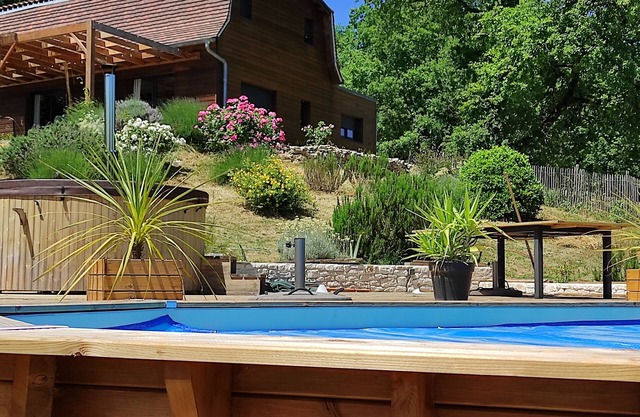 Dordogne Valley Lot timber-frame house set in greenery.