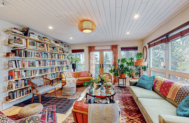 Downtown, art-filled apartment with fireplace, balcony, & well-equipped kitchen