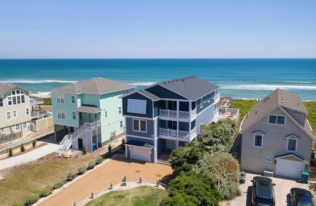 Duck oceanfront home with theater room and elevator, steps from the beach!