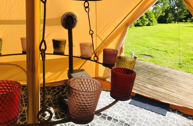 Eclipse, a furnished canvas bell tent in field and woodland surroundings