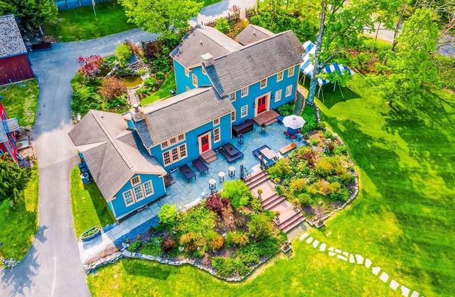 Elegant home with two living areas, a furnished patio, & wood fireplace