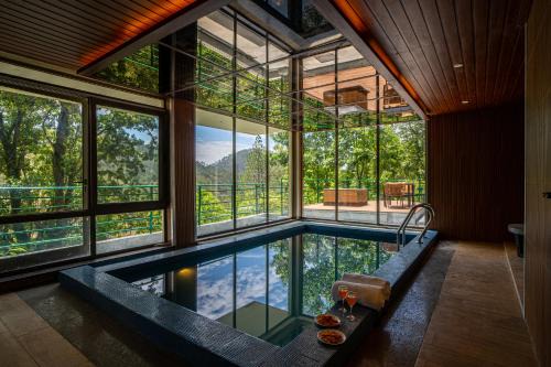 ELIVAAS Blushing Pines 3 BHK With Indoor Pool, Attic and Classy Interiors