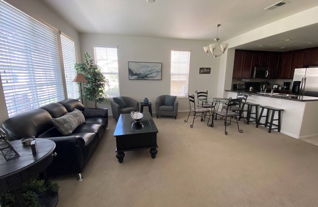 End-unit townhome with garage, patio, and office, near shopping and trails!