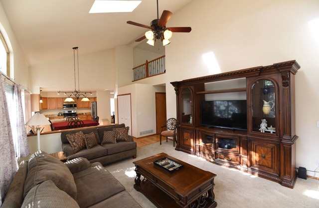 Enjoy the large patio and shaded back yard of this large home with 2 kitchens