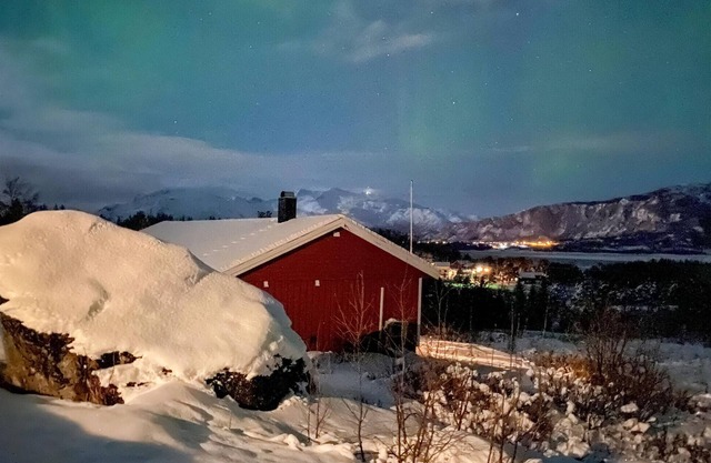 Enjoy the view of mountains and forests in this cozy vacation home.