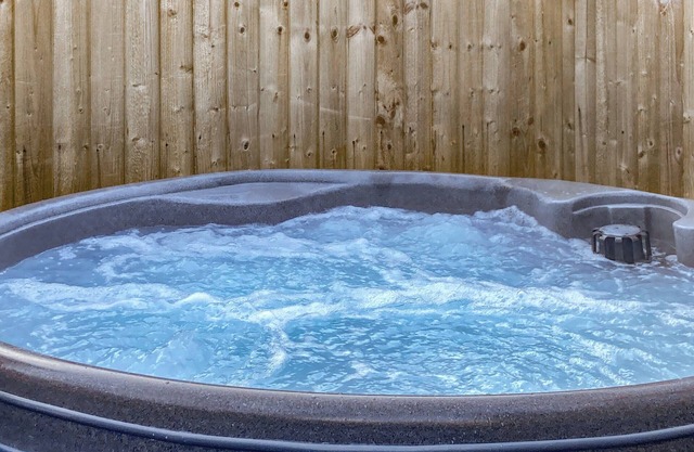 Escape to a charming Addingham retreat featuring a private hot tub.