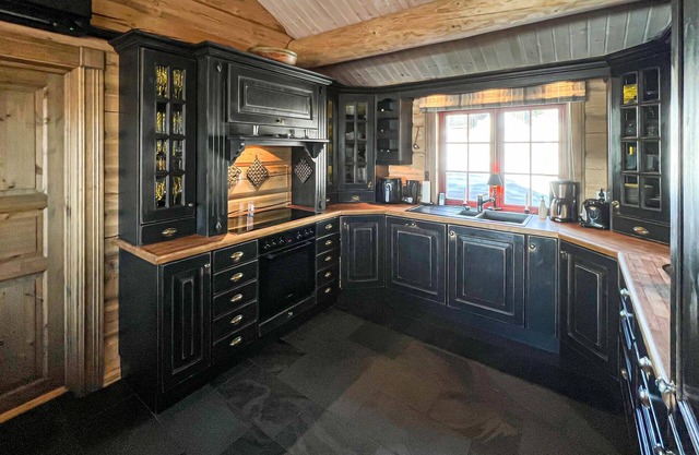 Experience peace and nature in a holiday home with mountain views and sauna.