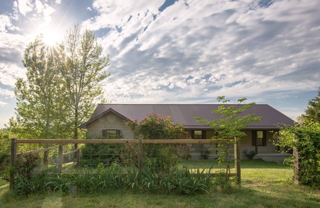 Farm house overlooking pastures by the Buffalo River. Perfect starry nights.