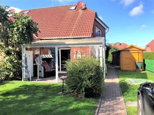 Ferienhaus Huus Wattenmeer in Nessmersiel mit Garten, Terrasse, Sauna, Räder, und Grill