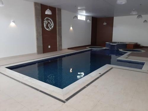 FLAT 410 no Cond Cavalinho Branco em Aguas de Lindoia