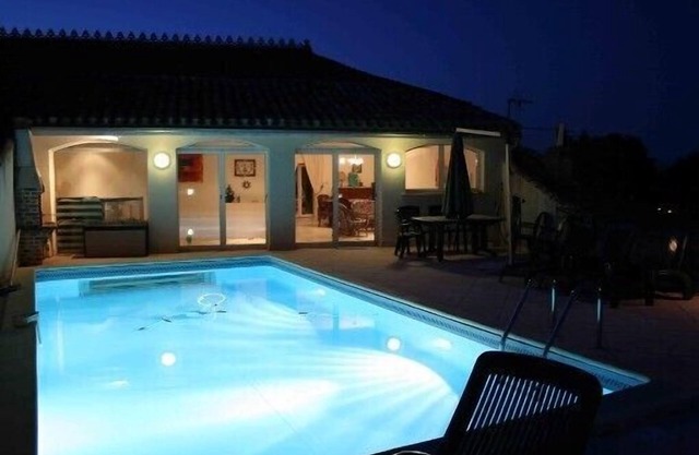Former grocery store with pool on the roof (transparent side)