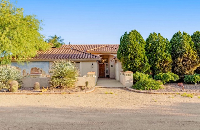 Gated home + casita with pool, spa, patio, outdoor kitchen, & exercise room