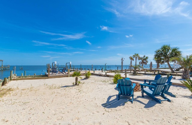 Get “Out of Office” and into this bayfront beauty! Private pier for Fishing.